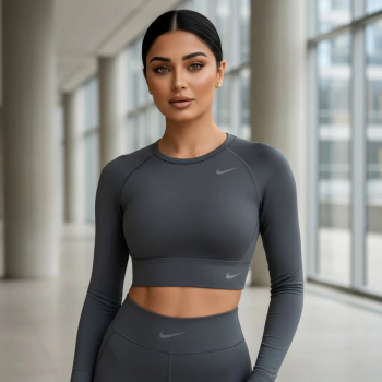 Woman in athletic wear posing indoors.