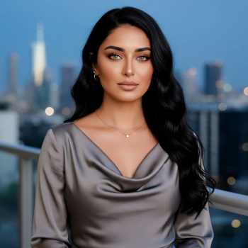 Woman in elegant dress with city backdrop.
